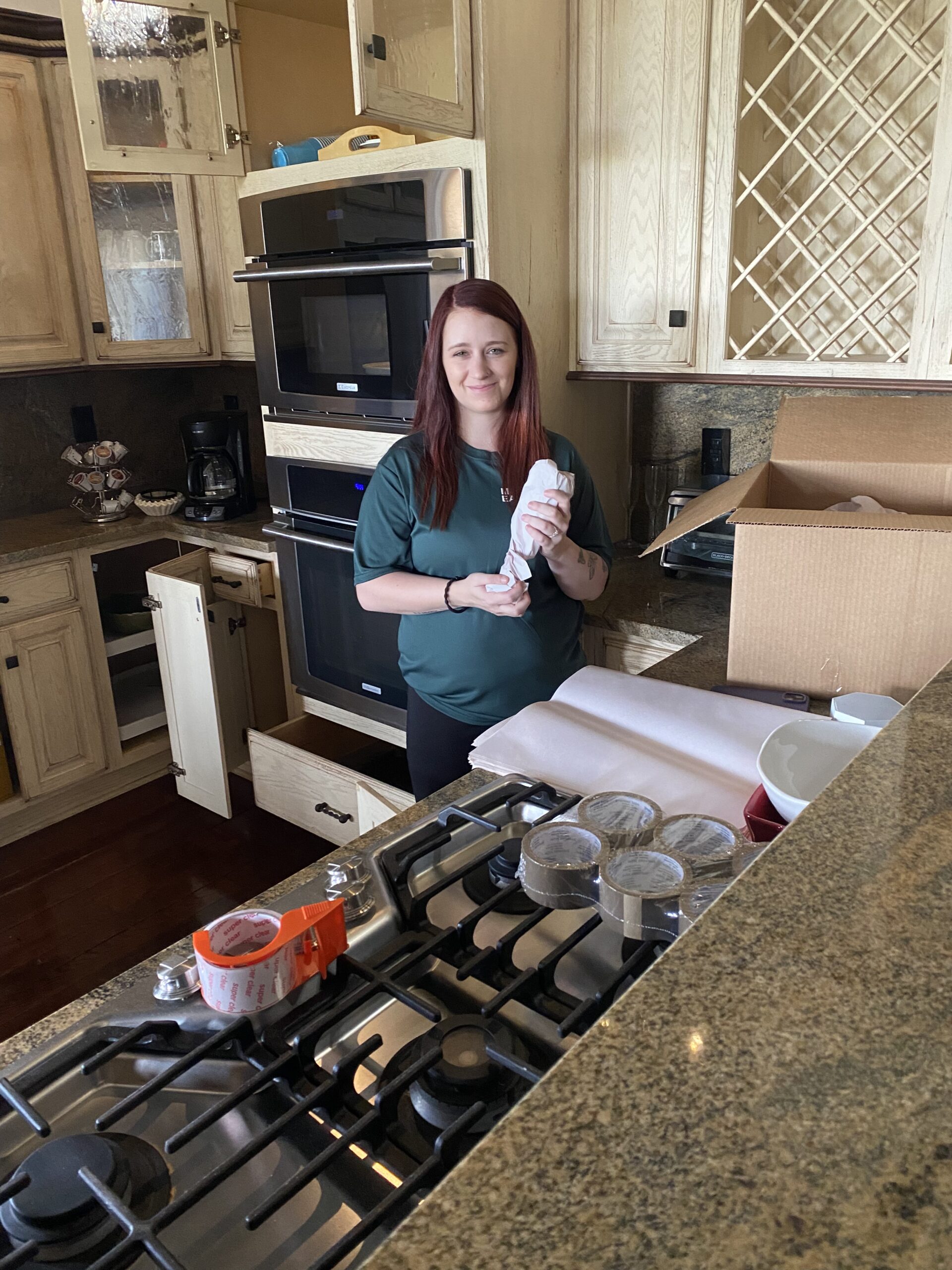 one of our movers packing up a kitchen