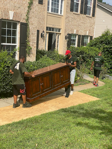 our movers carrying a big dresser